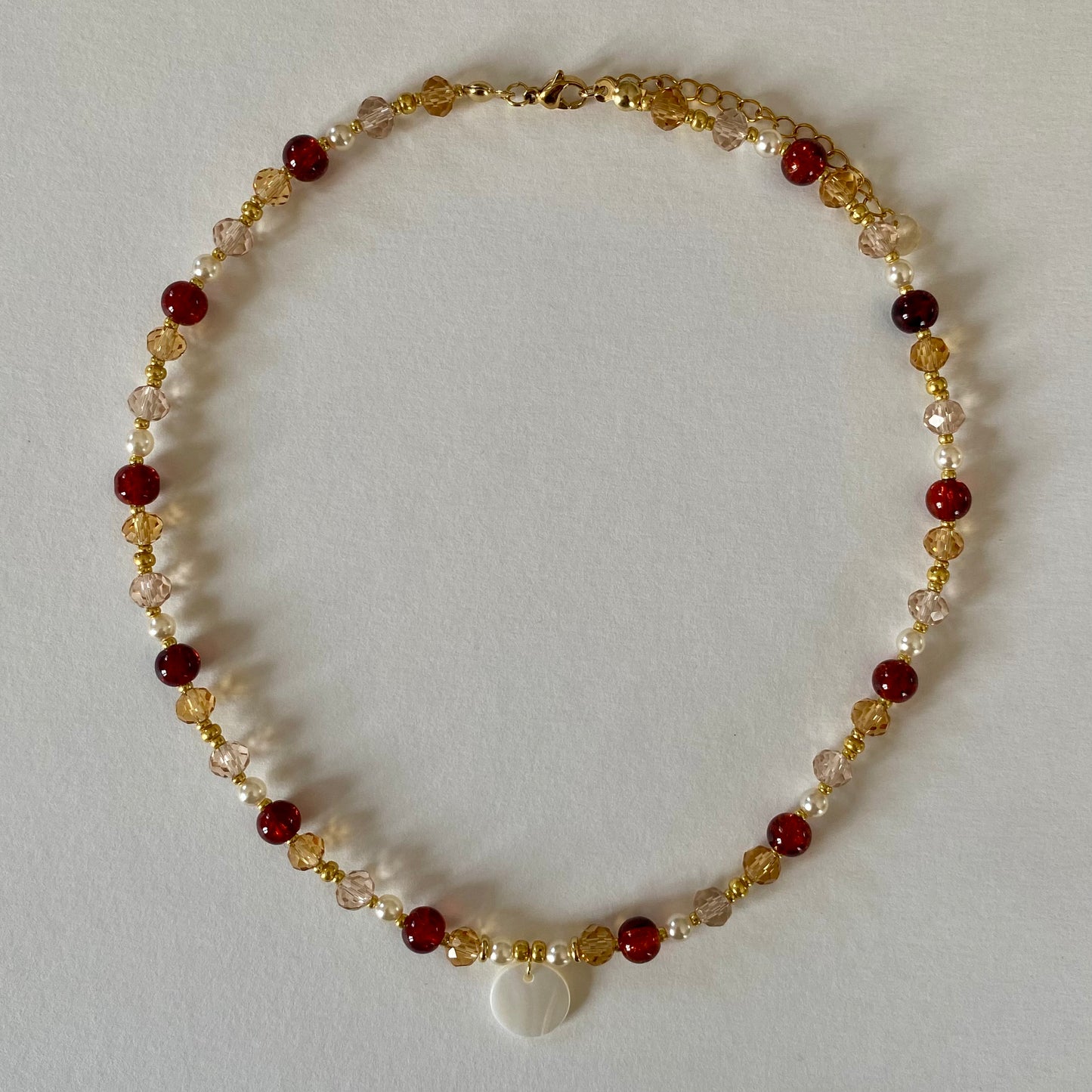 COLLIER INÍCIO DORÉ MARRON - PRODUIT